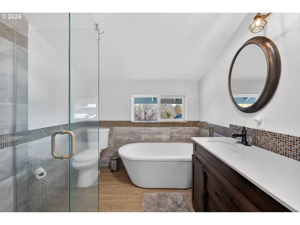 a bathroom with a toilet a sink and a mirror