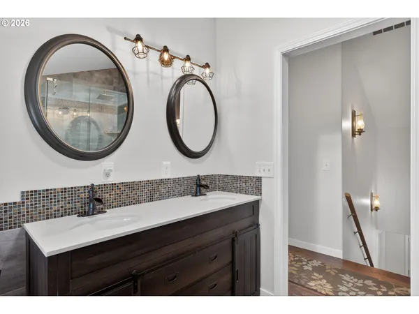 a bathroom with a sink a mirror and a toilet