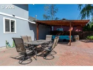 a view of a patio with table and chairs with wooden floor