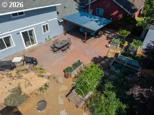 a wooden bench sitting in the middle of a yard