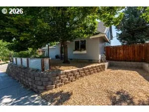 a view of a backyard of the house