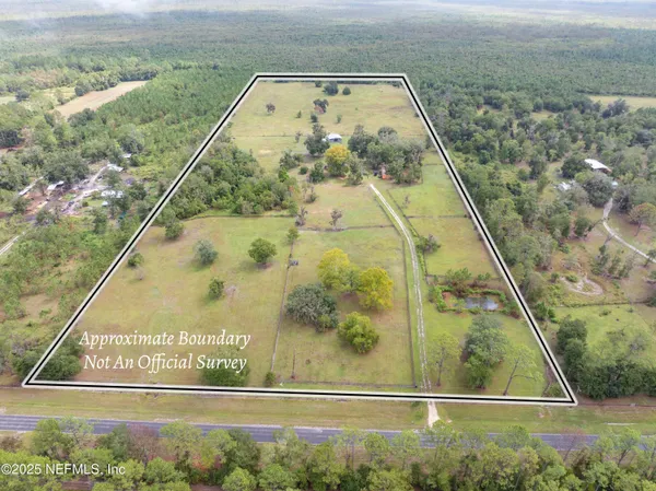 a view of a lake with a yard