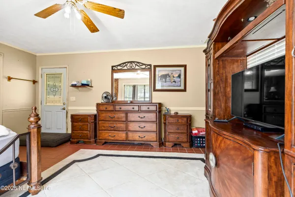 a view of room with window and ceiling fan