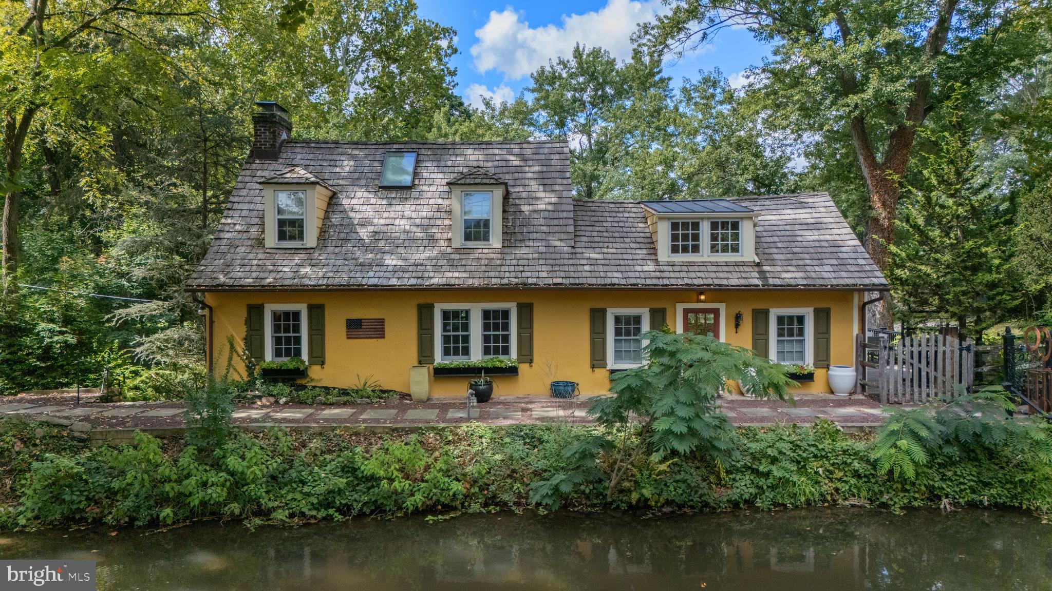 2472 River Road New Hope, PA 18938 - Photo 1 of 50 a front view of a house with a garden