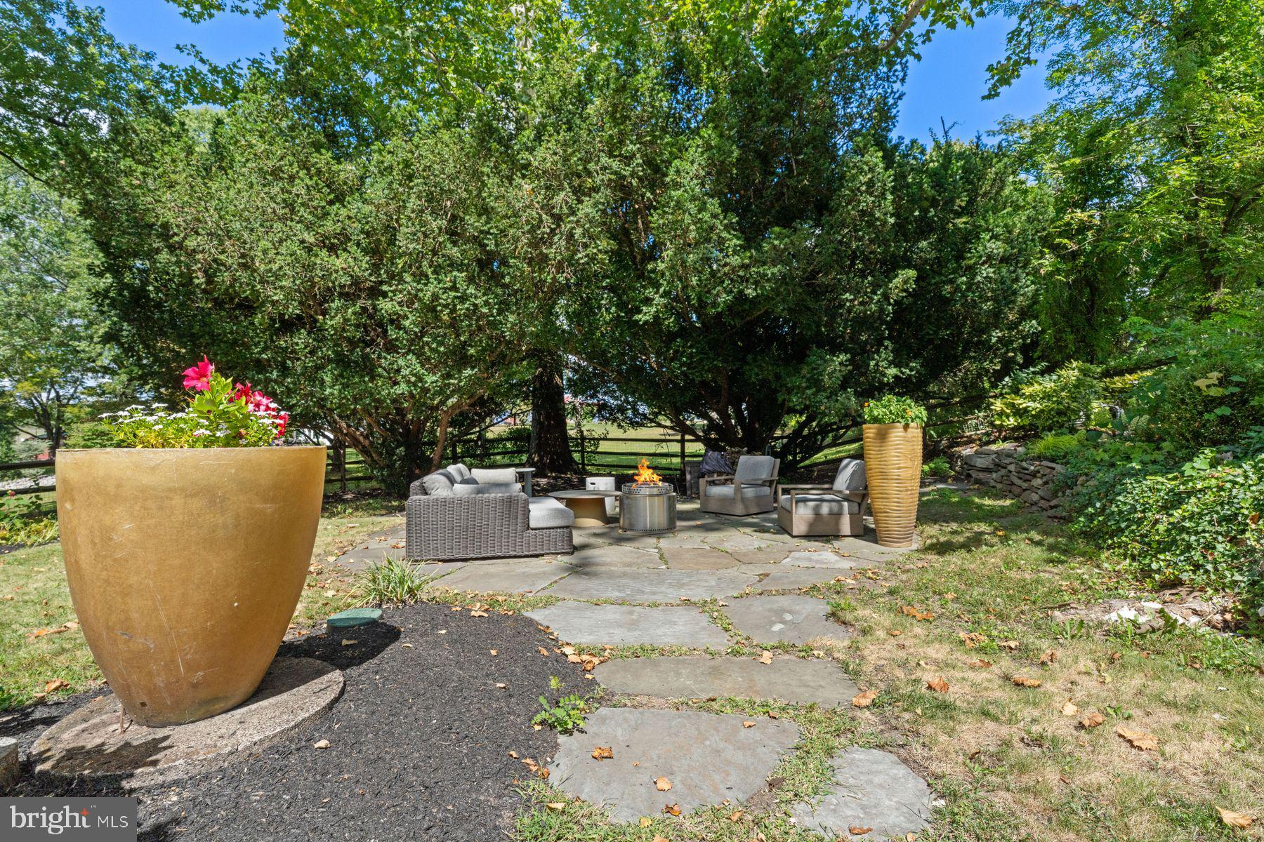 2472 River Road New Hope, PA 18938 - Photo 13 of 50 a view of a backyard with sitting area and entertaining space