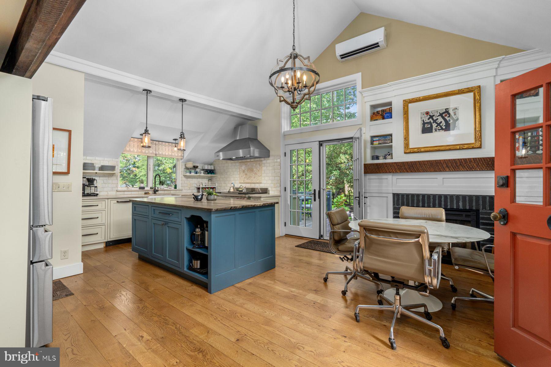 2472 River Road New Hope, PA 18938 - Photo 6 of 50 a kitchen with stainless steel appliances kitchen island granite countertop furniture and a wooden floor