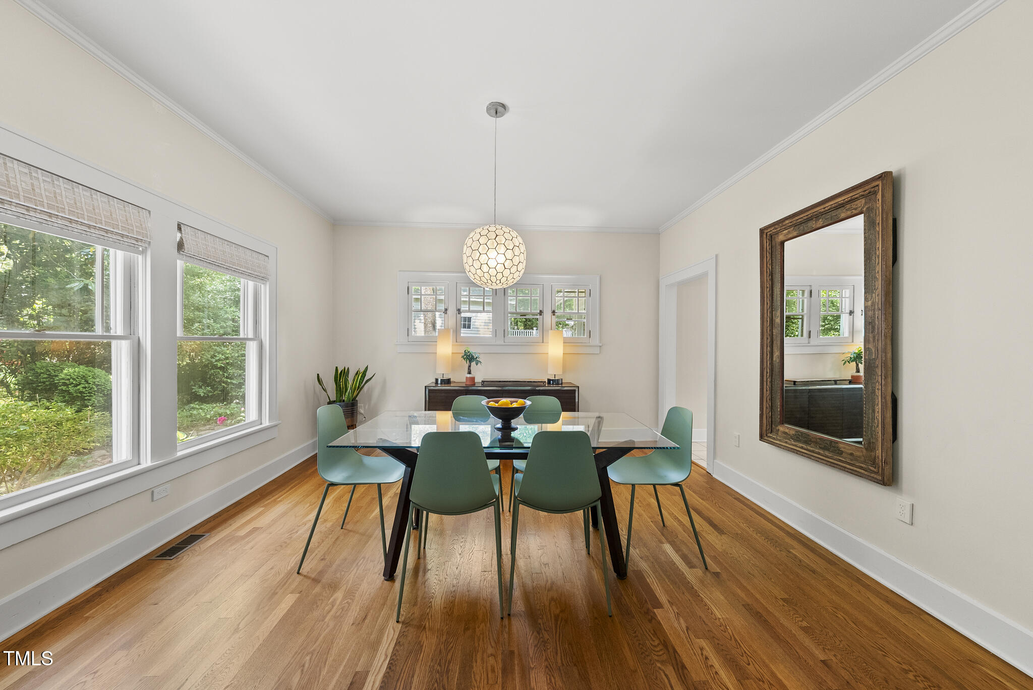 223 Hawthorne Road Raleigh, NC 27605 - Photo 17 of 47 a view of a dining room with furniture window and wooden floor