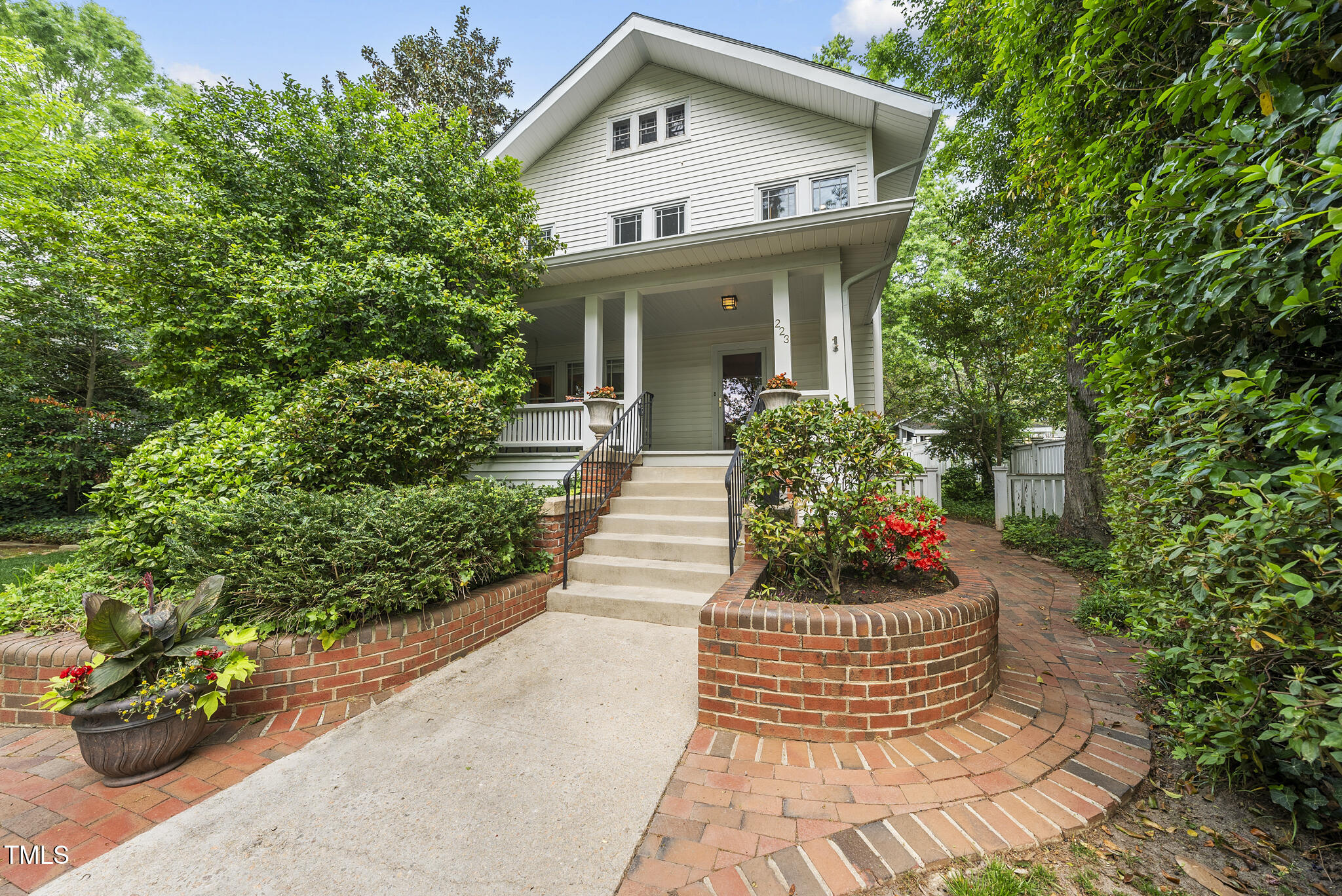223 Hawthorne Road Raleigh, NC 27605 - Photo 2 of 47 a front view of a house with a garden