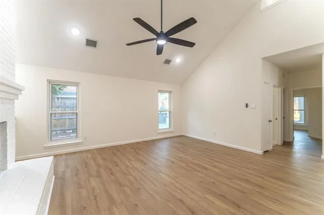 wooden floor in an empty room with a window