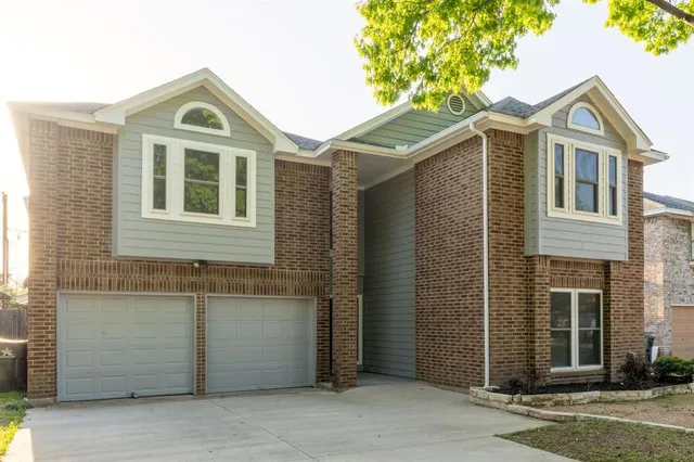 a front view of a house with a garage