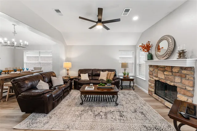 a living room with furniture or couch and a fireplace