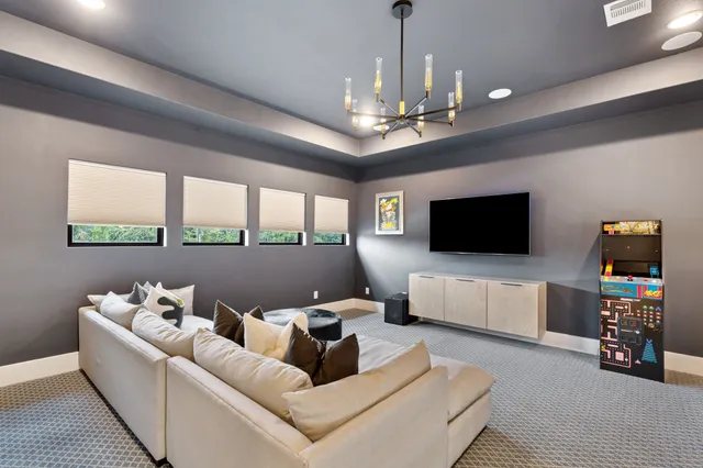 a bathroom with a granite countertop sink a toilet and a mirror