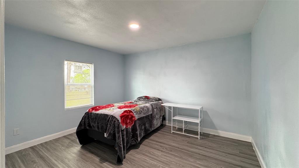 191 Harmon Road Gun Barrel City, TX 75156 - Photo 13 of 28 a bedroom with a bed and a window