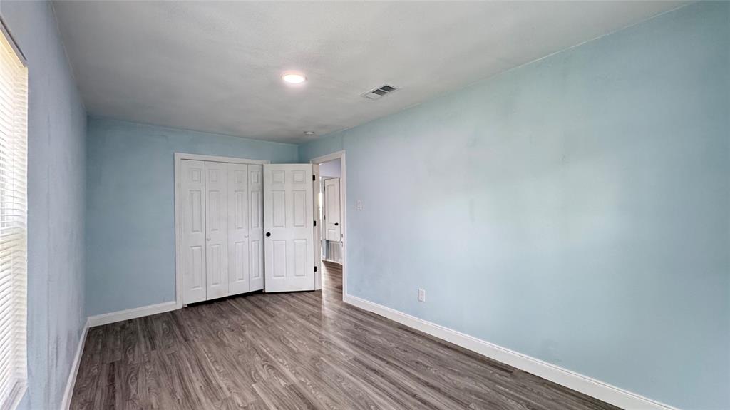 191 Harmon Road Gun Barrel City, TX 75156 - Photo 17 of 28 a view of an empty room and wooden floor