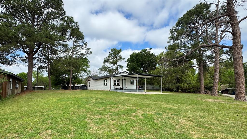 191 Harmon Road Gun Barrel City, TX 75156 - Photo 18 of 28 a view of house with yard and trampoline