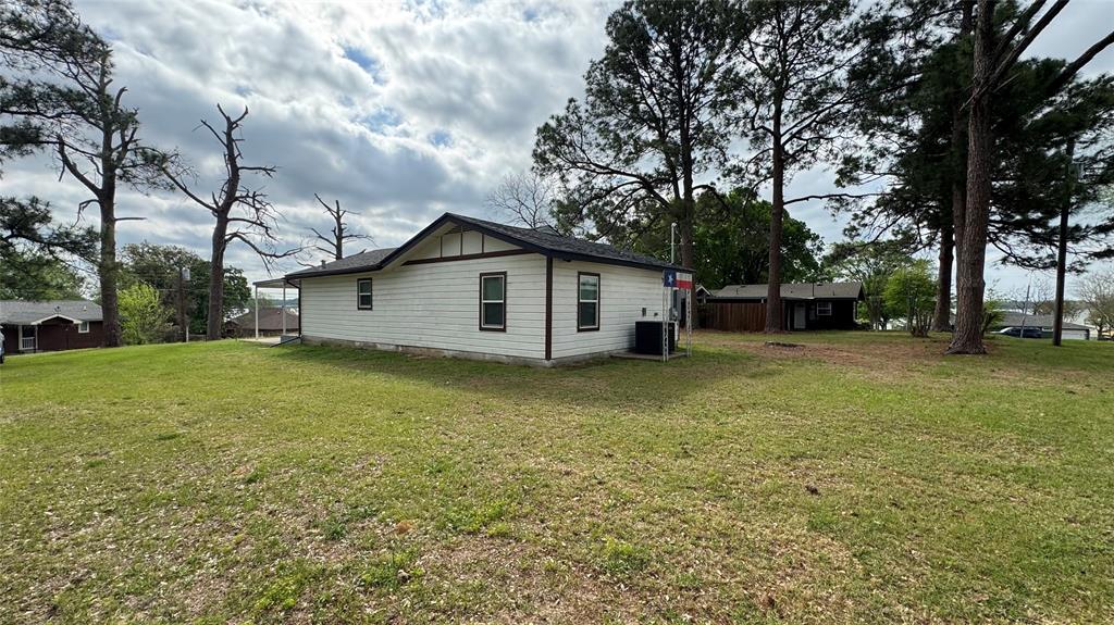 191 Harmon Road Gun Barrel City, TX 75156 - Photo 24 of 28 a view of a house with a yard