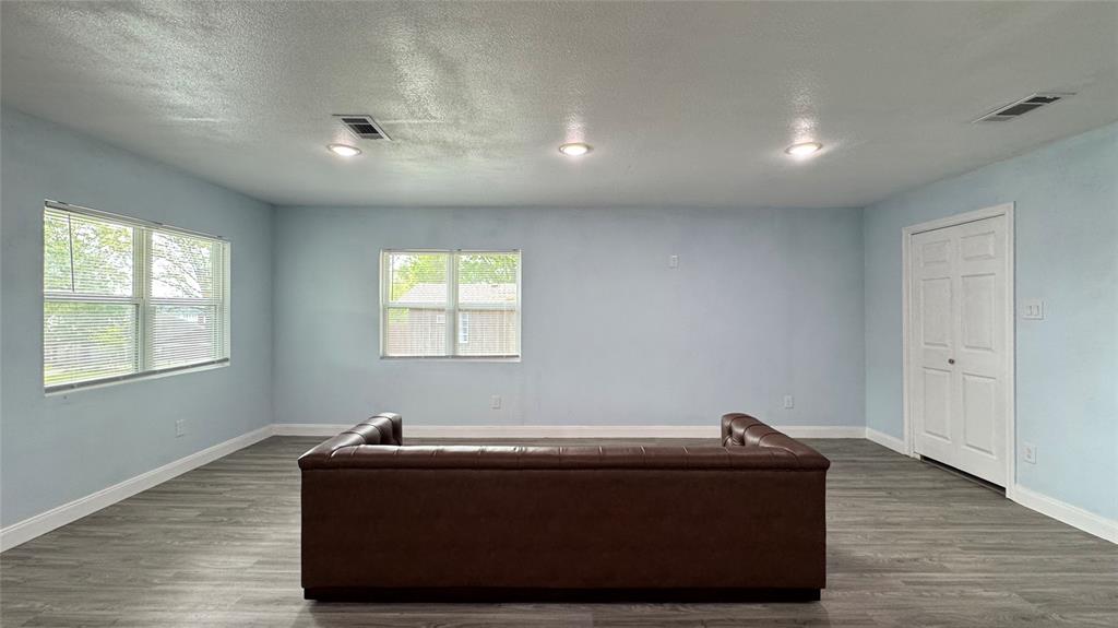 191 Harmon Road Gun Barrel City, TX 75156 - Photo 5 of 31 a room with wooden floor and window