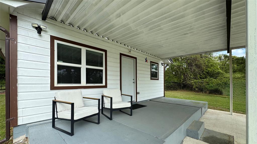 191 Harmon Road Gun Barrel City, TX 75156 - Photo 5 of 28 a view of a patio with table and chairs with wooden floor and fence