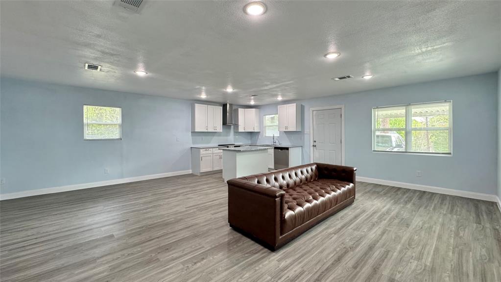 191 Harmon Road Gun Barrel City, TX 75156 - Photo 8 of 31 a living room with furniture and a wooden floor