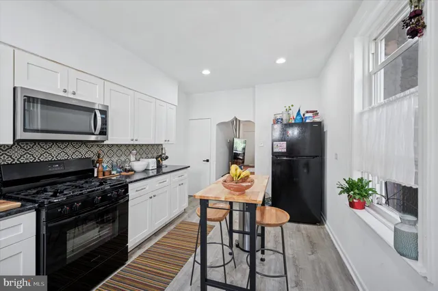a view of a street with brick building in front of it