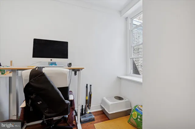 a view of an entryway with wooden floor