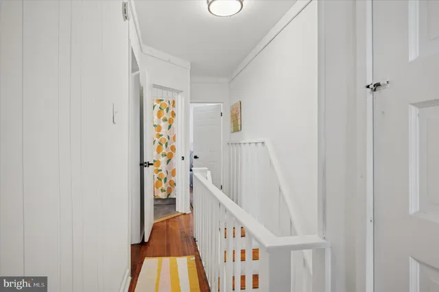 a bathroom with a toilet and a shower curtain