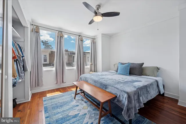 a bedroom with a bed and a fireplace