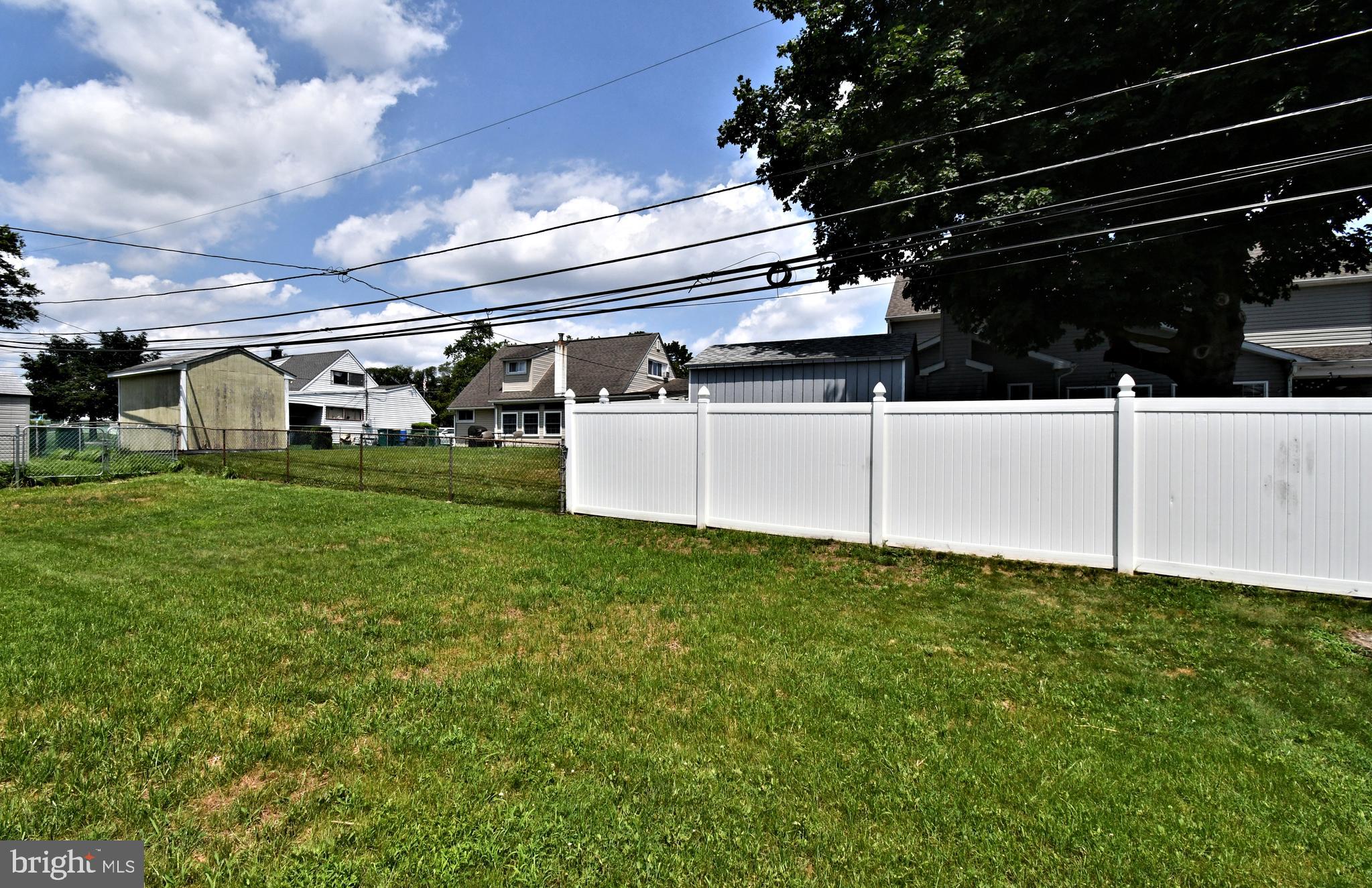 24 Conifer Road Levittown, PA 19057 - Photo 36 of 40 a view of a backyard with sitting area