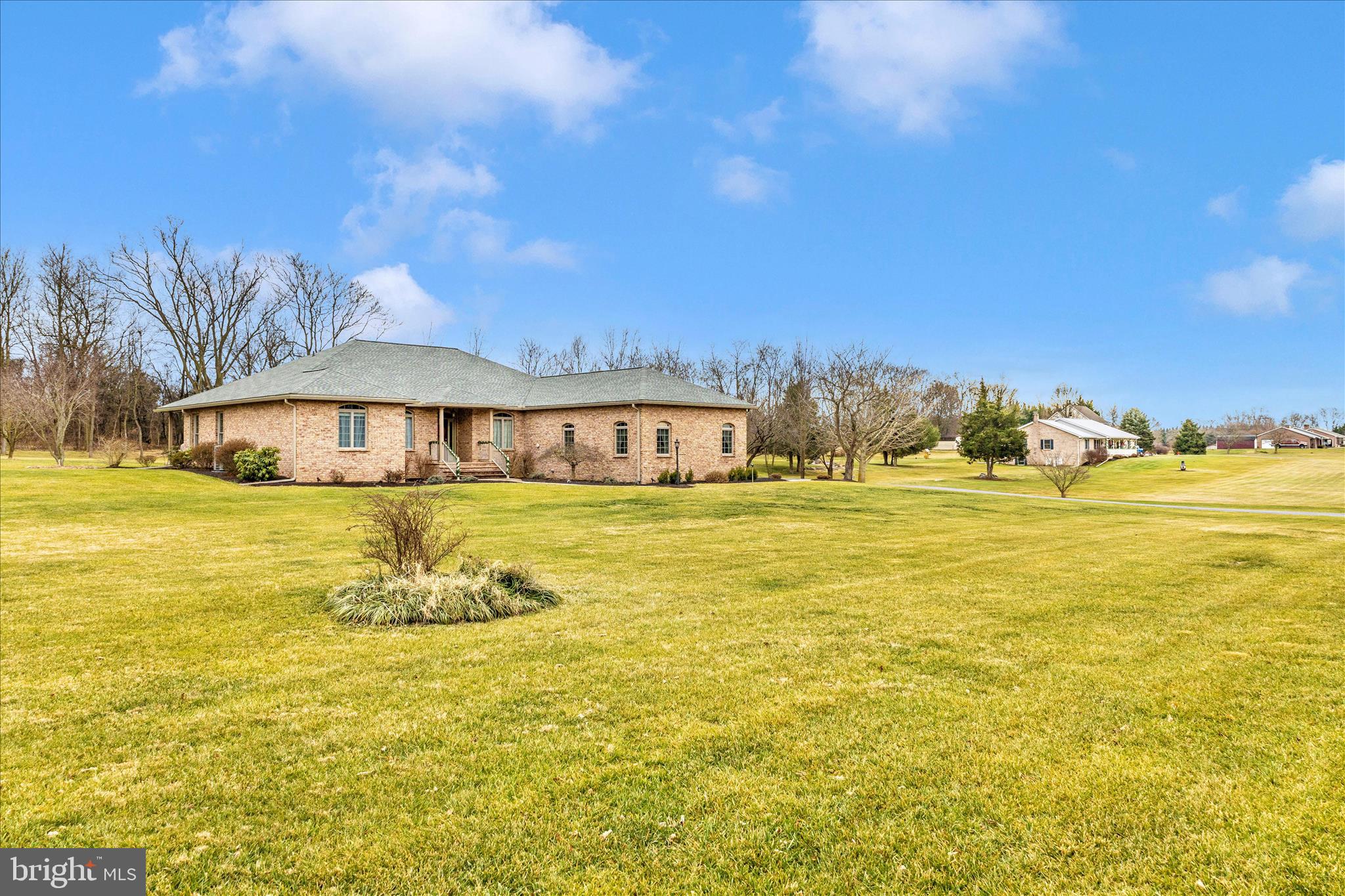 8971 Light Street Williamsport, MD 21795 - Photo 2 of 53 a front view of a house with a garden
