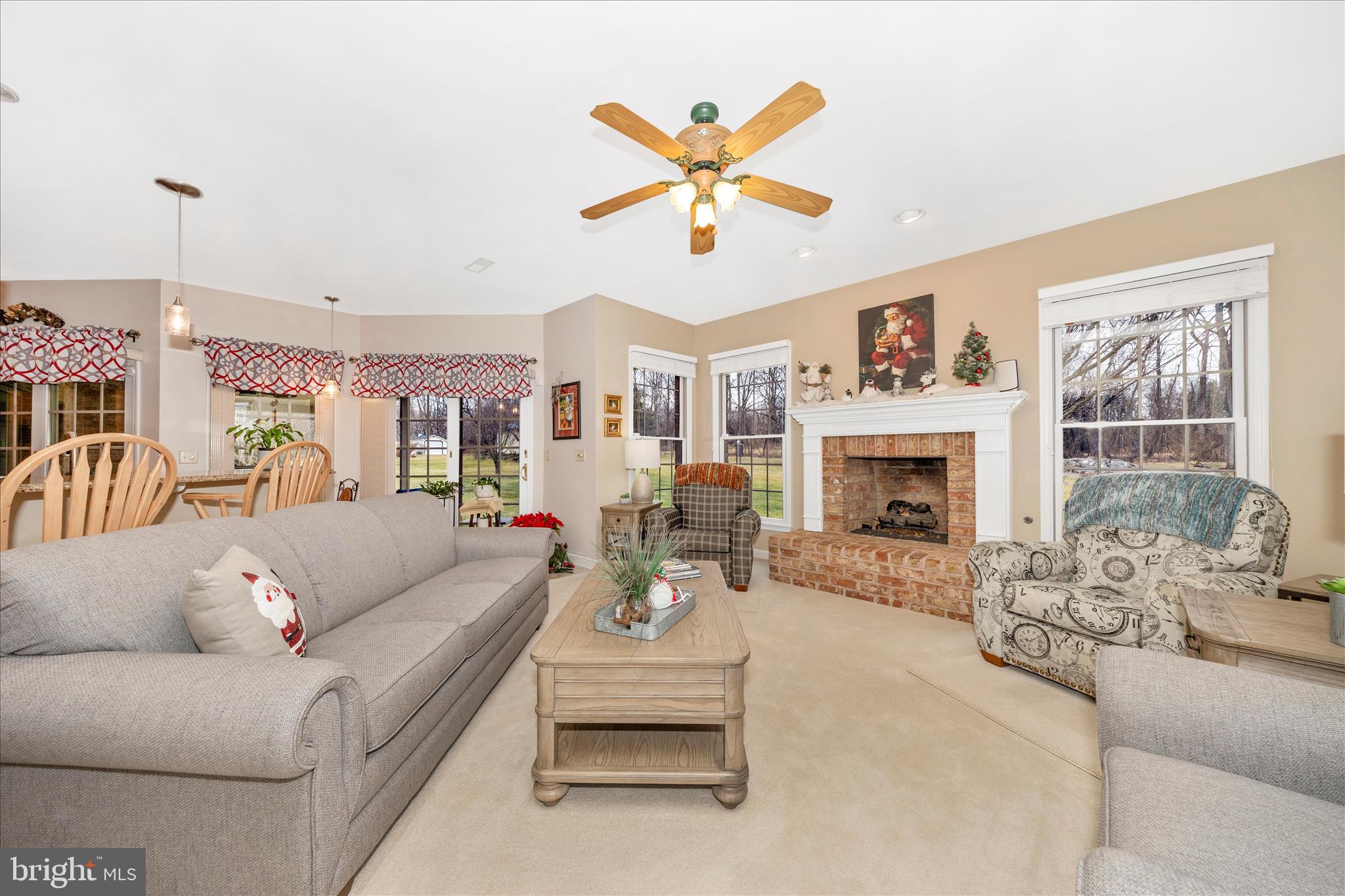 8971 Light Street Williamsport, MD 21795 - Photo 24 of 53 a living room with furniture a fireplace and a chandelier