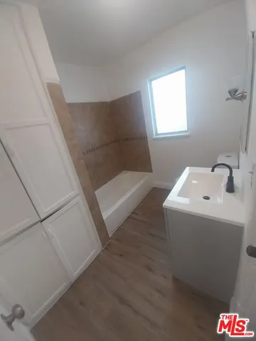 a bathroom with a sink and mirror