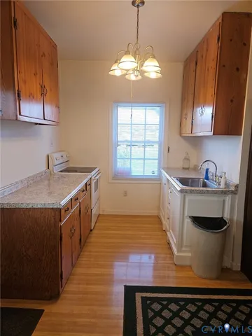 a kitchen with sink cabinets and window