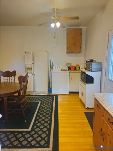 a kitchen with a stove and a refrigerator