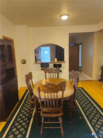 a room with furniture pool table and a window