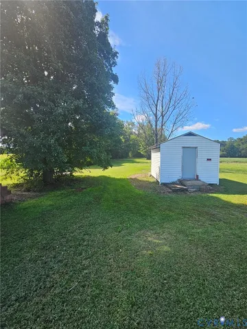 a backyard of a house with lots of green space
