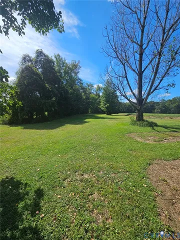 a view of a field with an trees