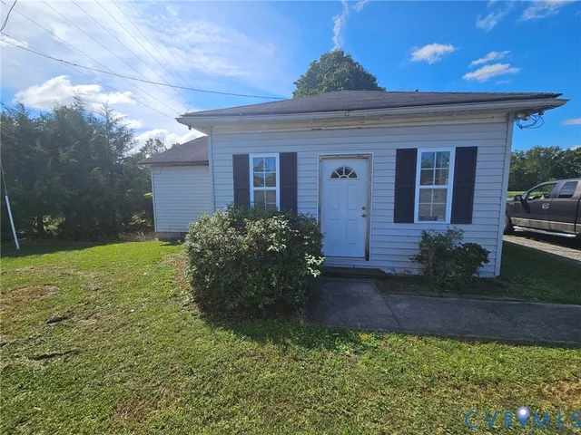 a view of a house with a garden