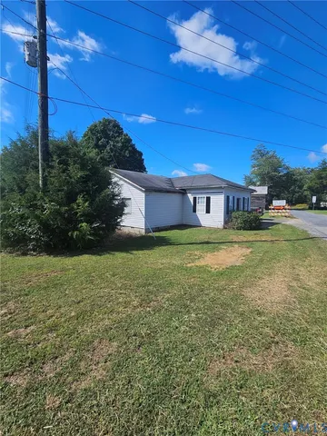 a view of a swimming pool with an outdoor space and seating area