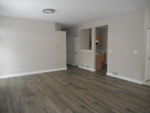 710 Timothy Court East Dundee, IL 60118 - Photo 7 of 25 wooden floor in an empty room