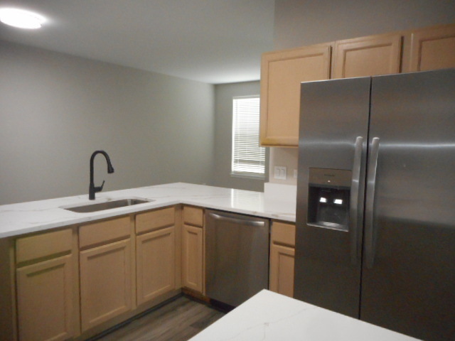 710 Timothy Court East Dundee, IL 60118 - Photo 10 of 25 a kitchen with a sink and refrigerator