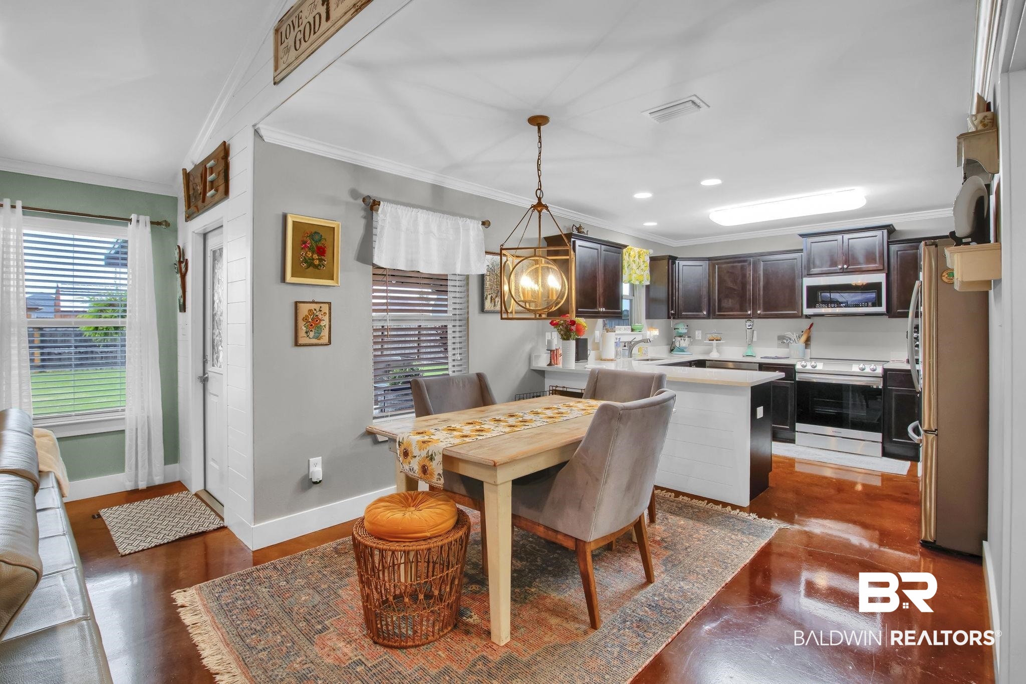 203 Lakefront Circle Summerdale, AL 36580 - Photo 20 of 69 Dining space with an inviting chandelier and crown molding