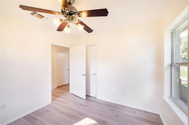 a view of a hallway with a window