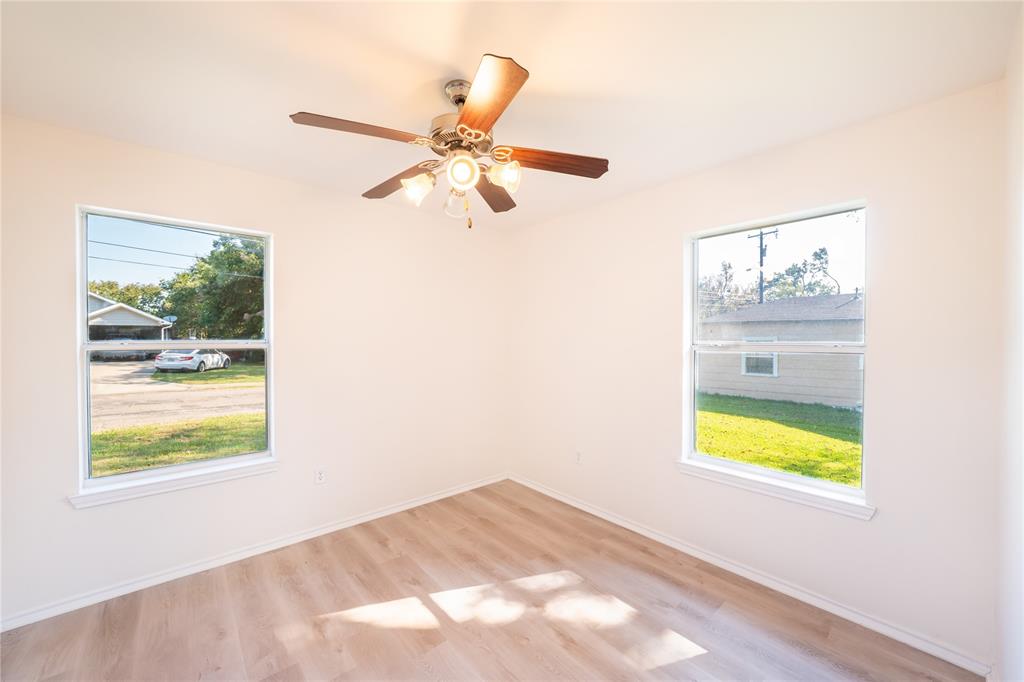714 East 12th Street Bonham, TX 75418 - Photo 13 of 18 a view of a hallway with a window