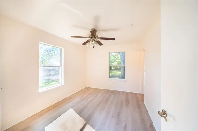 a view of a room with a wooden floor