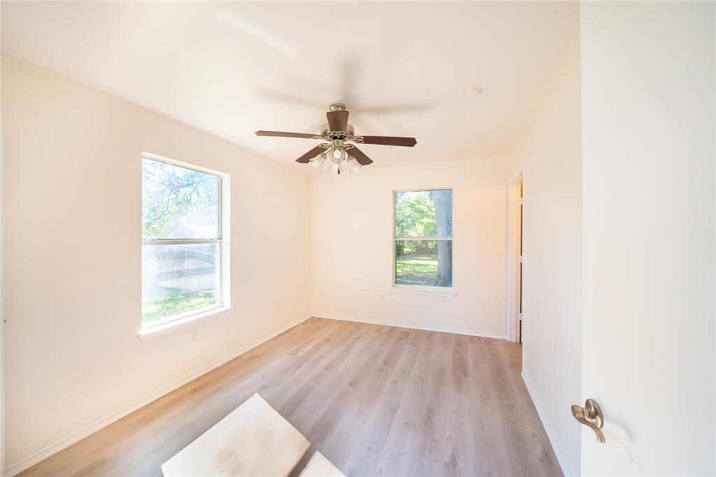 714 East 12th Street Bonham, TX 75418 - Photo 14 of 18 a view of a room that has a window in it