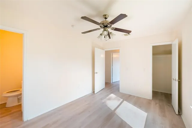 a view of a bathroom from a hallway