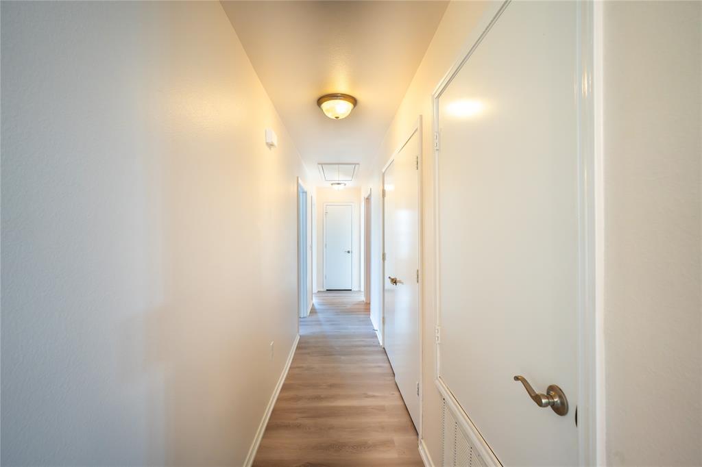 714 East 12th Street Bonham, TX 75418 - Photo 9 of 18 a view of a bathroom from a hallway