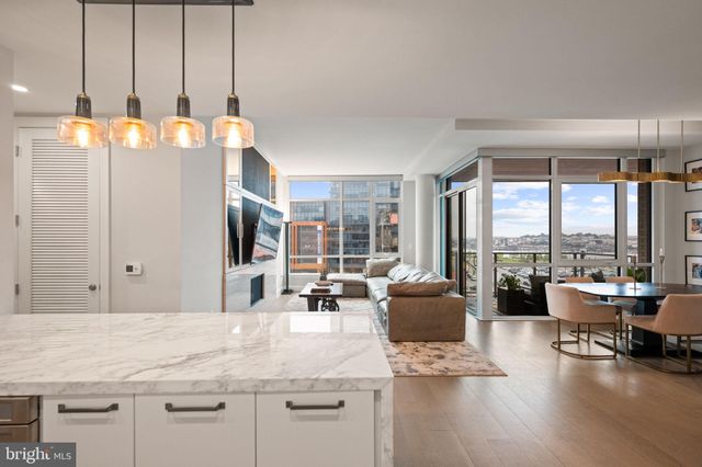 a view of a balcony with lake view and a potted plant