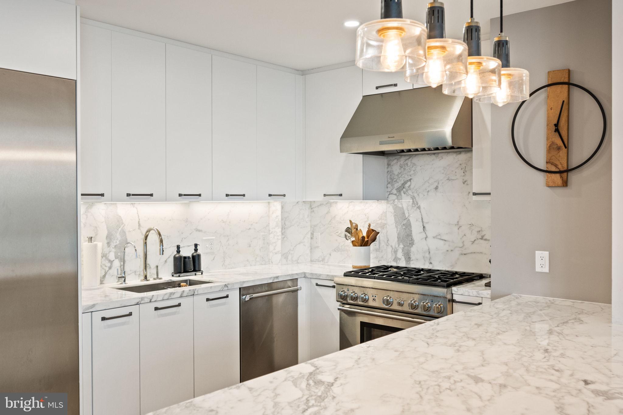 1330 Lancaster Street, Unit C603 Baltimore, MD 21231 - Photo 11 of 63 a kitchen with cabinets and steel stainless steel appliances