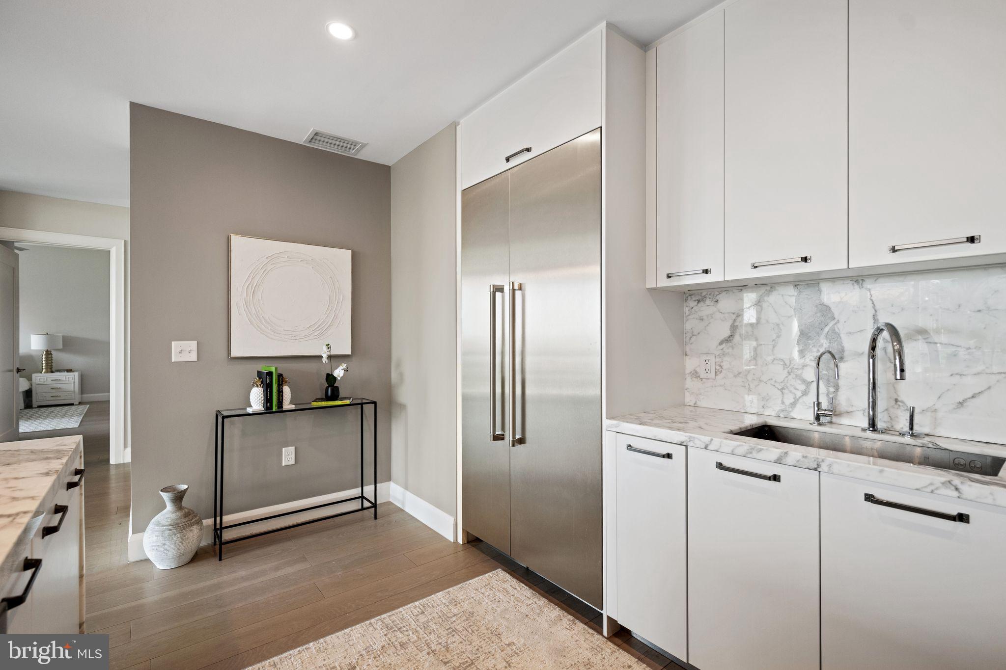 1330 Lancaster Street, Unit C603 Baltimore, MD 21231 - Photo 16 of 59 a kitchen with stainless steel appliances granite countertop a sink and cabinets